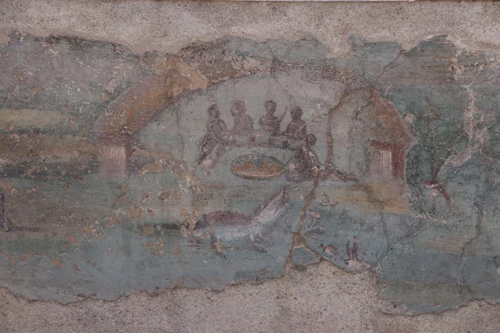 I.7.12 Pompeii. September 2021.
Detail of painted panel on inside of west side of triclinium towards south end. Photo courtesy of Klaus Heese.