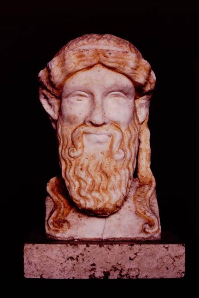 I.7.11 Pompeii, 1982 or 1983. Small sculptured head found on slender posts on east side of garden area. Source: The Wilhelmina and Stanley A. Jashemski archive in the University of Maryland Library, Special Collections (See collection page) and made available under the Creative Commons Attribution-Non-Commercial License v.4. See Licence and use details. J80f0490
Wilhelmina described this as “an archaic-style head of Zeus in white marble with lively traces of colour (0.19m high.”
See Jashemski, W. F., 1993. The Gardens of Pompeii, Volume II: Appendices. New York: Caratzas. (p.40)
See Maiuri, A., 1928. Nuovi Scavi nella Via dell’Abbondanza. Milano: Hoepli. (p.73, fig.37).