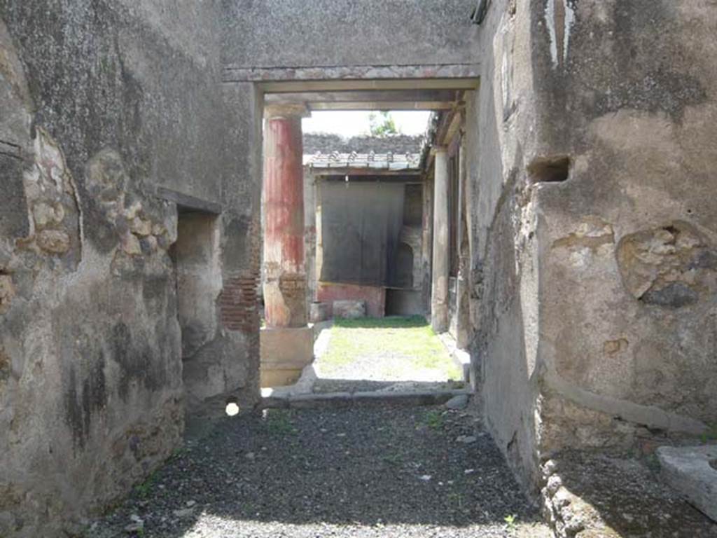 I.7.12 Pompeii. May 2012. Looking west from entrance doorway across north portico. Photo courtesy of Buzz Ferebee.