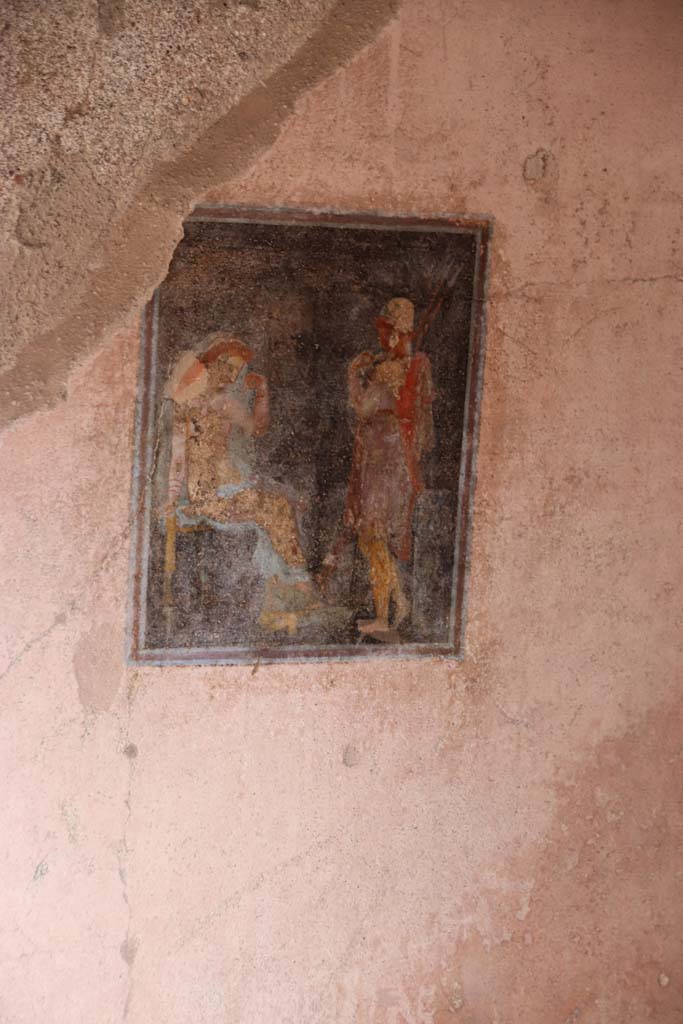 I.7.19 Pompeii. September 2021.
Wall painting of Paris and Helen from north wall above bed recess. Photo courtesy of Klaus Heese.