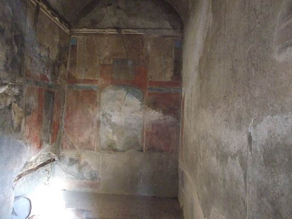 I.7.19 Pompeii. December 2006. Looking east in cubiculum, in north-east corner of peristyle. According to Peters, on the east wall was found a large sacral-idyllic landscape. The painting was enclosed in a segmental arch, the landscape surrounded by a flat, dark band. The lower portion had suffered from damp (even in 1963) and could only be described from a photo taken in earlier years. Above the aedicula, a nearly square painting also pictured a landscape with a figure, probably Marsyas.
See Peters, W.J.T. (1963): Landscape in Romano-Campanian Mural Paintings.The Netherland, Van Gorcum & Comp. (p.68-69, & fig.49)