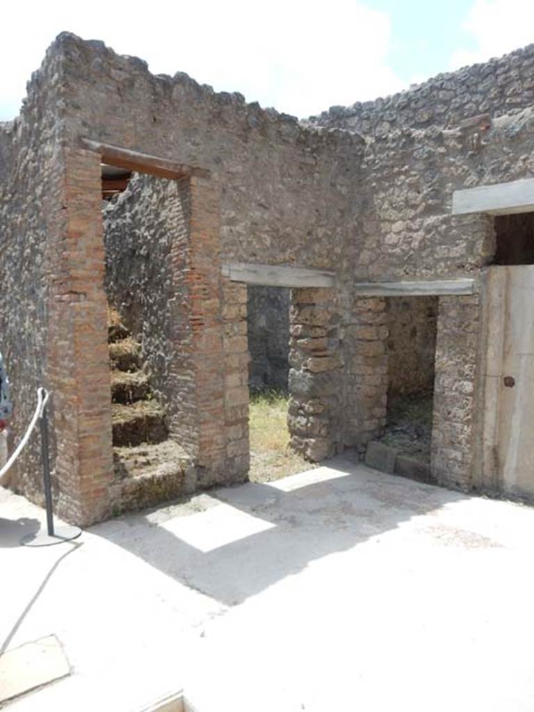 I.7.19 Pompeii. May 2017. Stairs to upper level on west side near entrance corridor and doorways to rooms in north-west corner of atrium. Photo courtesy of Buzz Ferebee.