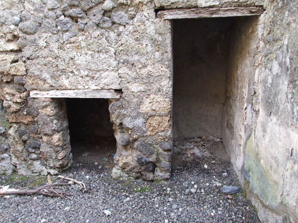 I.7.19 Pompeii. December 2006.Two small cupboards under the stairs in room in north-west corner of atrium.