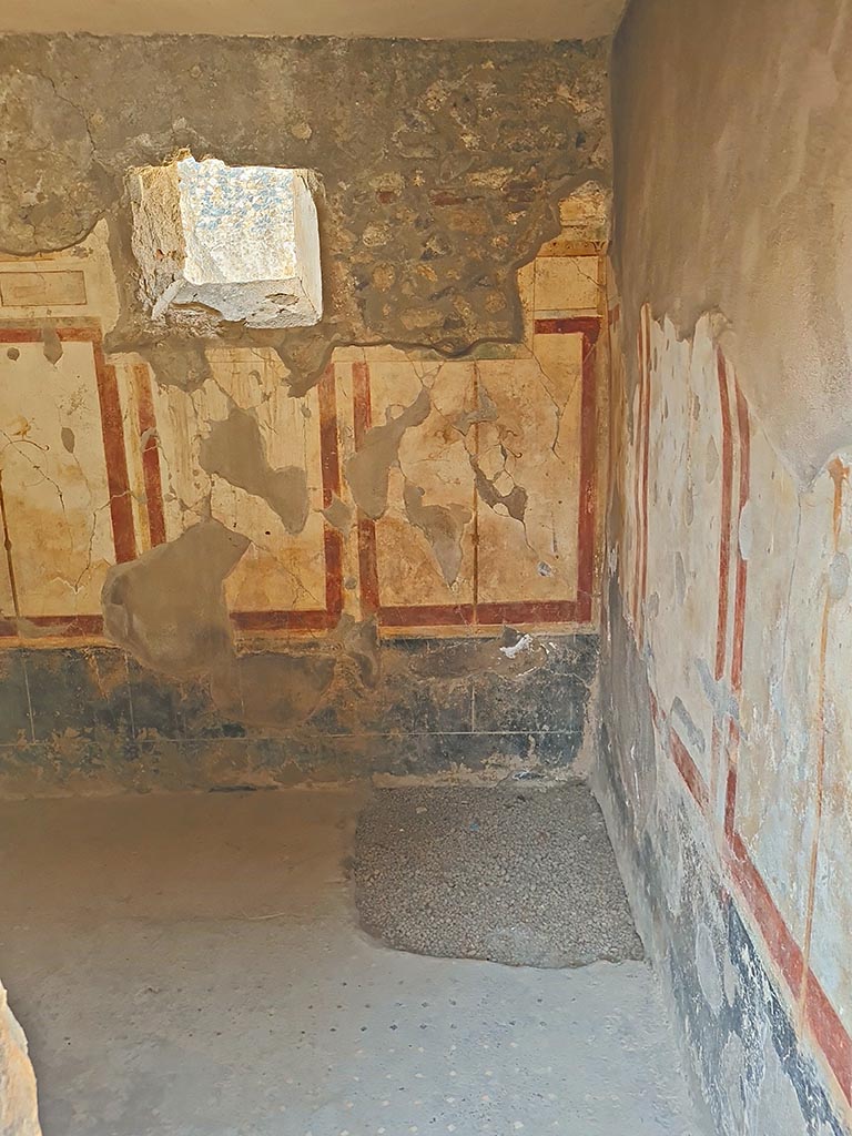 I.7.19 Pompeii. September 2024.
Looking west through doorway into cubiculum in south-west corner of atrium. Photo courtesy of Giuseppe Ciaramella.