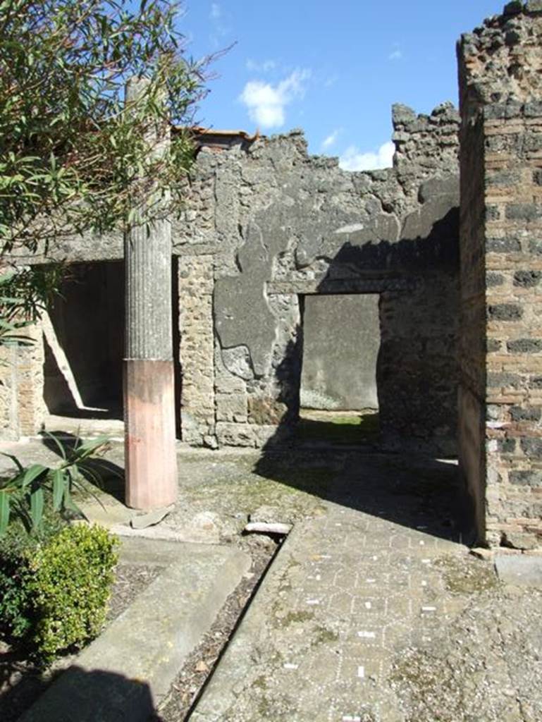 I.9.5 Pompeii. March 2009. Room 12. South side of peristyle, showing gutter and portico floor. Looking east.