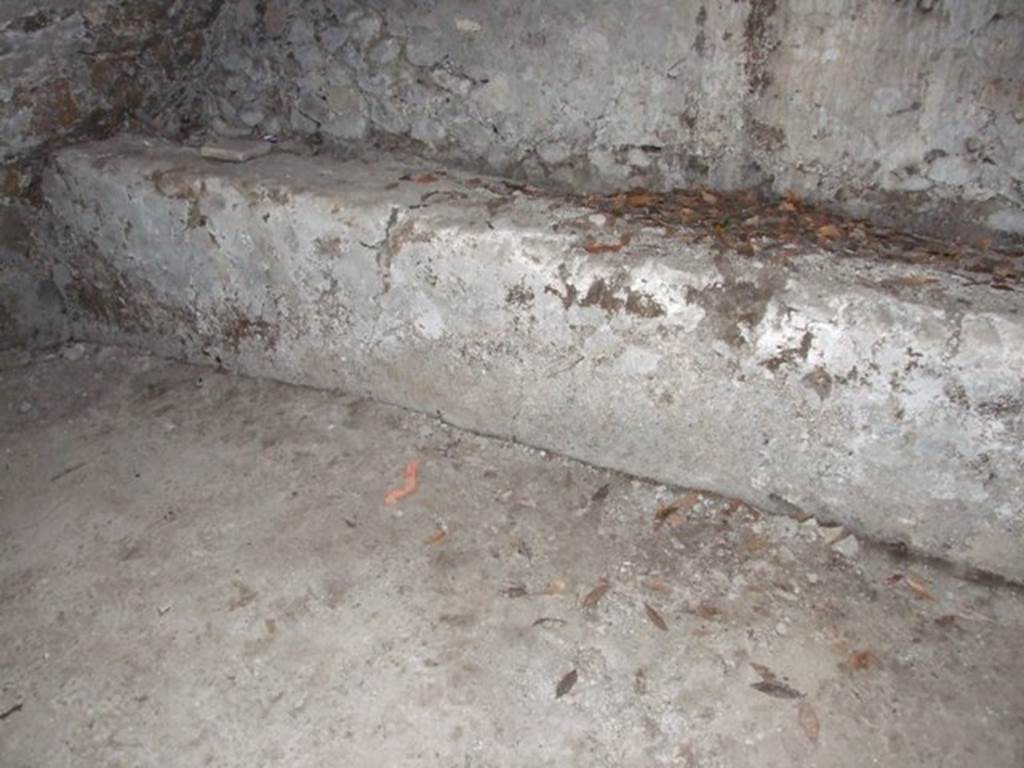 I.10.4 Pompeii. March 2009. Second Lower storeroom B. North wall. West end of bench against north wall. The chest containing the famous silver collection was found approximately where the red mark is shown on the floor.