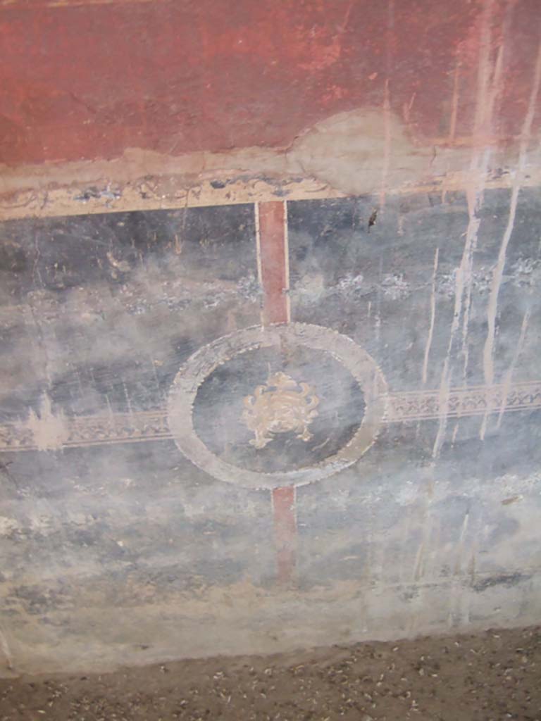 I.10.4 Pompeii. May 2006. Room 18, west wall on south side near doorway to peristyle.
