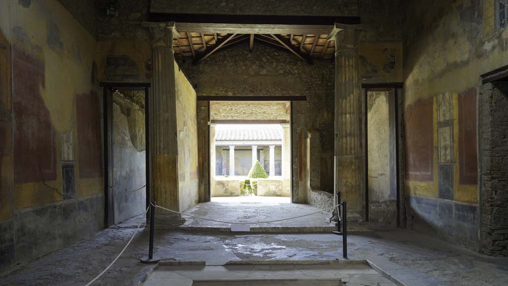I.10.4 Pompeii. August 2021.
Looking south across impluvium in atrium towards the tablinum, room 8. Photo courtesy of Robert Hanson.