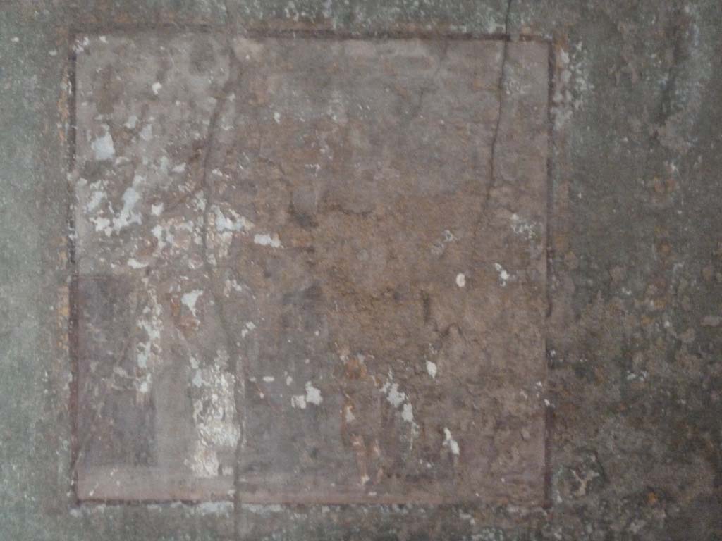 I.10.4 Pompeii. May 2010. Room 11, north wall. Faded damaged central wall painting.
According to PPM - The central painting on the north wall depicts a young Dionysus and Maenad, (51cm x 51cm).
See Carratelli, G. P., 1990-2003. Pompei: Pitture e Mosaici: Vol. II. Roma: Istituto della enciclopedia italiana, (p. 301, no. 94).
According to Kuivalainen –
The central painting on the east wall depicts a satyr with a cupid, on the west wall Perseus and Andromeda.
He describes the painting on the north wall as –
“A composition of two figures. On the left a robed female figure stands with her weight on her left foot leaning on a pillar with her right arm, on which hangs a cloak; she has a thyrsus with a bunch of leaves on top and stretches her left hand towards a small boy in the middle; he raises both his hands towards the female’s hands above him. Behind them, on the right side, there is a door.”
See Kuivalainen, I., 2021. The Portrayal of Pompeian Bacchus. Commentationes Humanarum Litterarum 140. Helsinki: Finnish Society of Sciences and Letters, (p.199, G16).