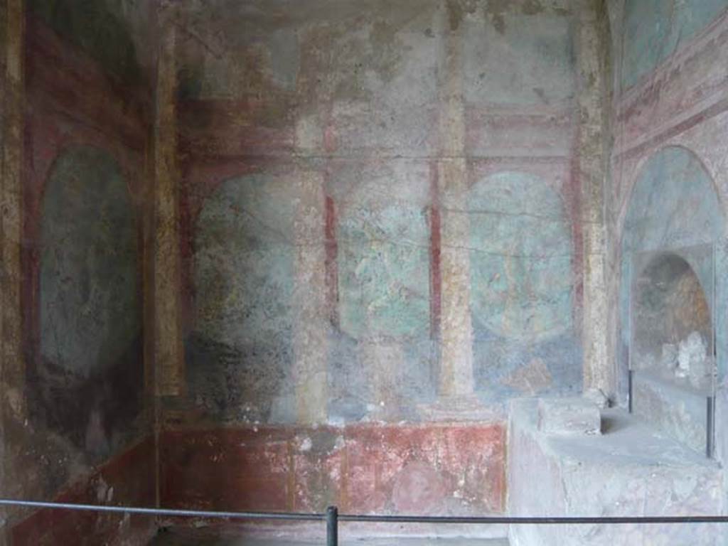 I.10.4 Pompeii. May 2012. Alcove 25, south wall with painted columns and pilasters opening onto a painted garden with trees and birds. Photo courtesy of Buzz Ferebee.