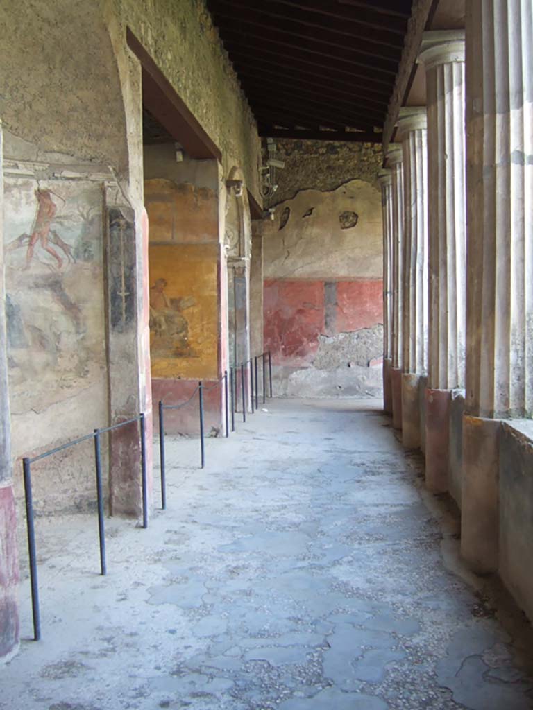 I.10.4 Pompeii. December 2006.
Looking west along south side of peristyle with alcoves 22, 23, 24 and 25.
