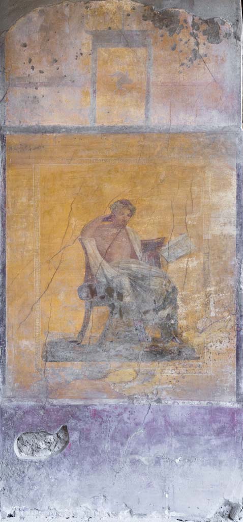 I.10.4 Pompeii. April 2022.
Alcove 23, centre of west wall with painting of poet.
Photo courtesy of Johannes Eber.