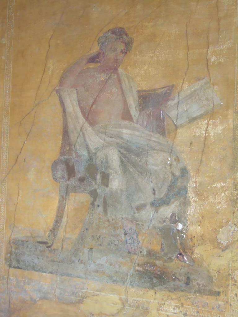 I.10.4 Pompeii. May 2006. Alcove 23, wall painting of poet.
The name of Menander was inscribed by the painter on the skirt of the man’s cloak. (CIL IV 7350a)
See Cooley, A. and M.G.L., 2004. Pompeii: A Sourcebook. London: Routledge. (p. 70)