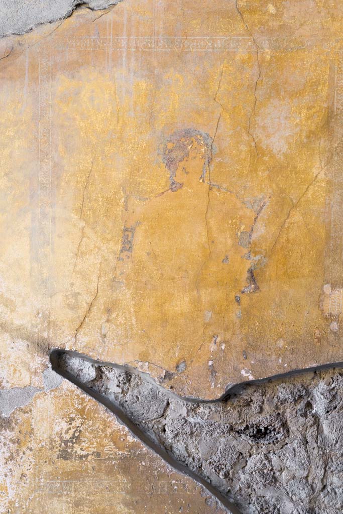 I.10.4 Pompeii. April 2022.
Alcove 23, detail from middle panel on east wall. Photo courtesy of Johannes Eber.