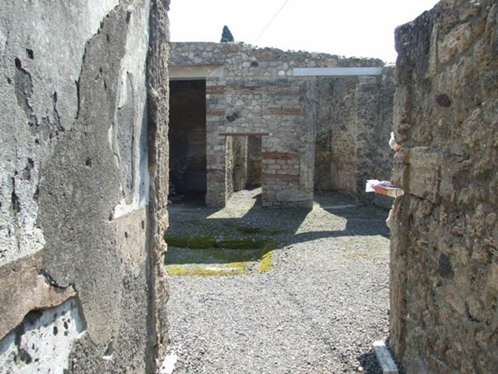 I.10.8 Pompeii. March 2009. Looking south along entrance corridor to Room 1. Atrium.