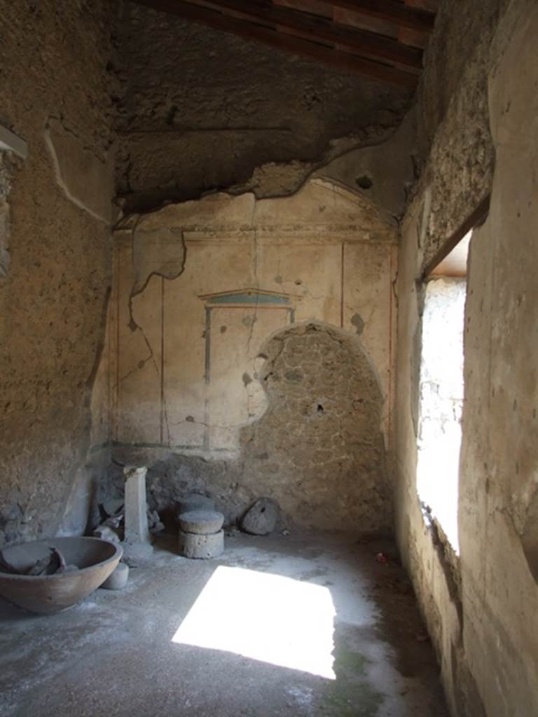 I.10.8 Pompeii. March 2009. Room 3, cubiculum. Looking east.
The walls of this small rectangular room with vaulted ceiling were decorated in the 4th Style,
The flooring of cocciopesto was coloured in red.
The room was lit by a high small window in the north wall and by a larger window in the south wall.
