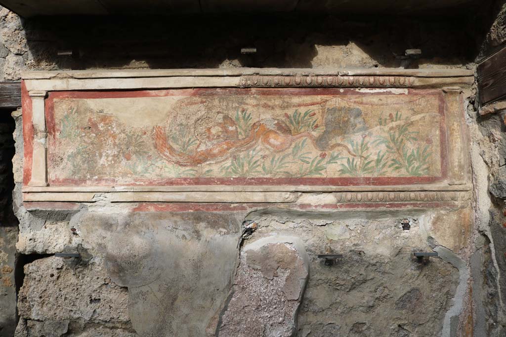 I.11.11 Pompeii. December 2018. Lararium on north wall of bar-room. Photo courtesy of Aude Durand.