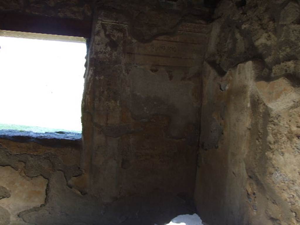 I.11.11 Pompeii. December 2006.
Room for the clients/customers, east wall and south-east corner, of room with window overlooking garden.