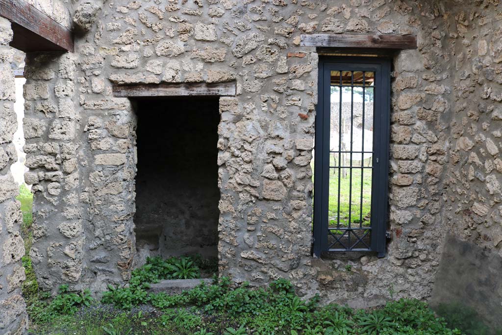 I.11.11 Pompeii. December 2018. Looking east from linking room between I.11.10/11/12, through doorway leading to garden.
On the left is another latrine, at the rear of the garden latrine in I.11.10. Photo courtesy of Aude Durand.