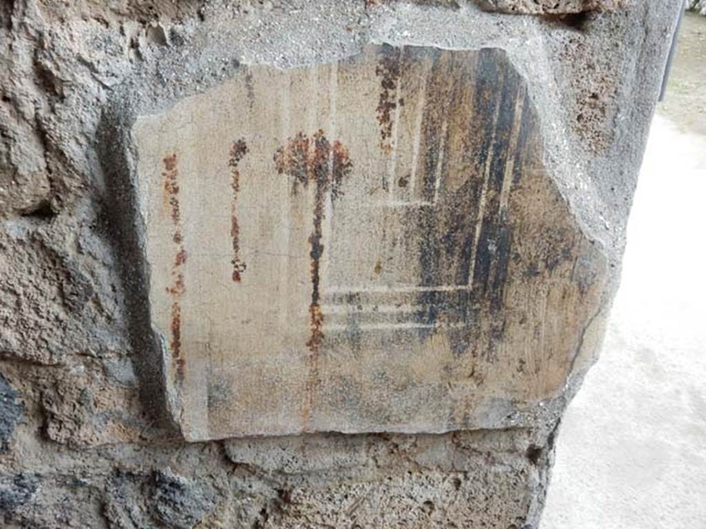 II.3.3 Pompeii. May 2016. Room 16, north wall with painted decoration near door-post. Photo courtesy of Buzz Ferebee.