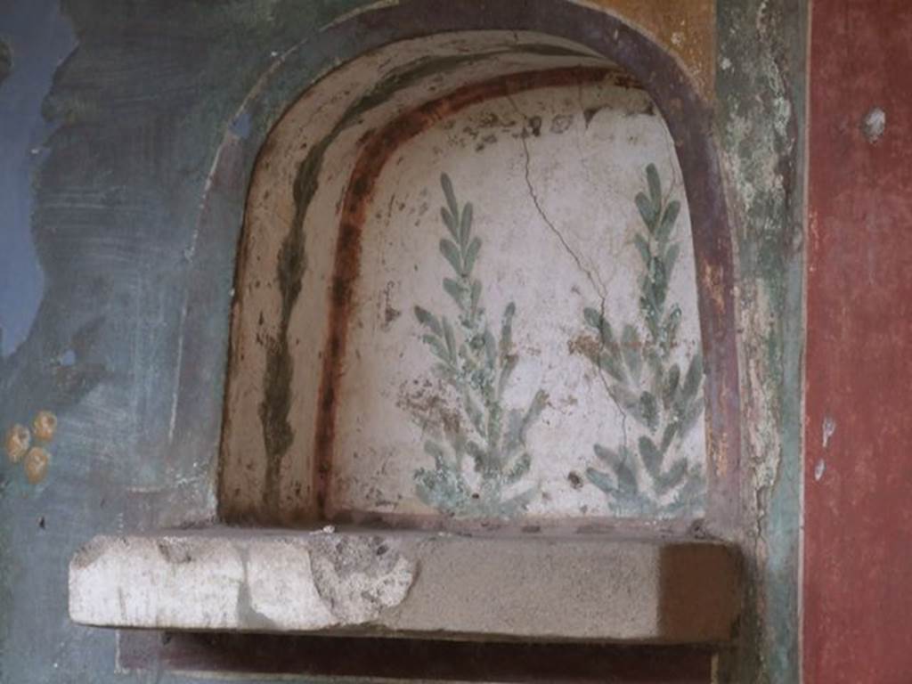 II.3.3 Pompeii. December 2006. Room 11, west panel on south wall of peristyle. Niche painted with plants.