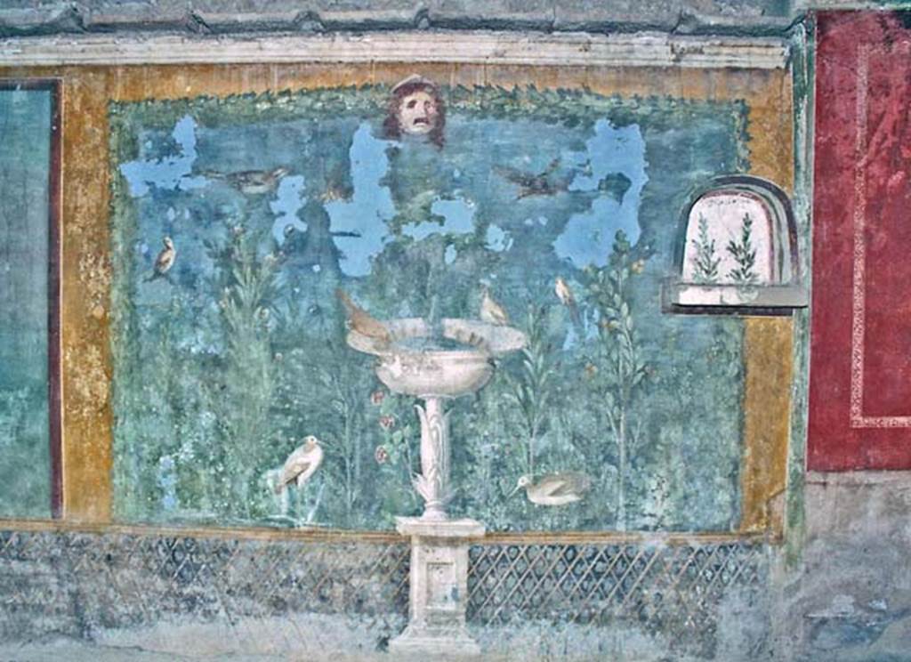 II.3.3 Pompeii. October 2001. Room 11, west panel of south wall of peristyle.
Wall painting of fountain with garden, mask and birds. Photo courtesy of Peter Woods.