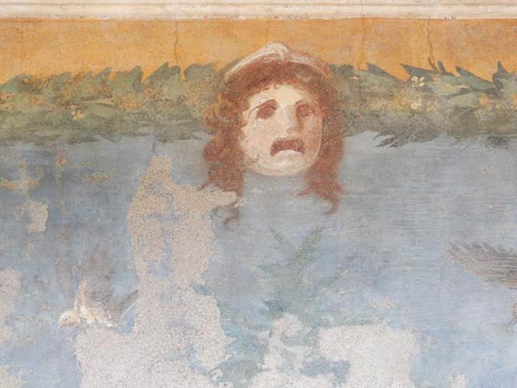 II.3.3 Pompeii. May 2016. Room 11, detail of mask from west panel of south wall.
Photo courtesy of Buzz Ferebee.