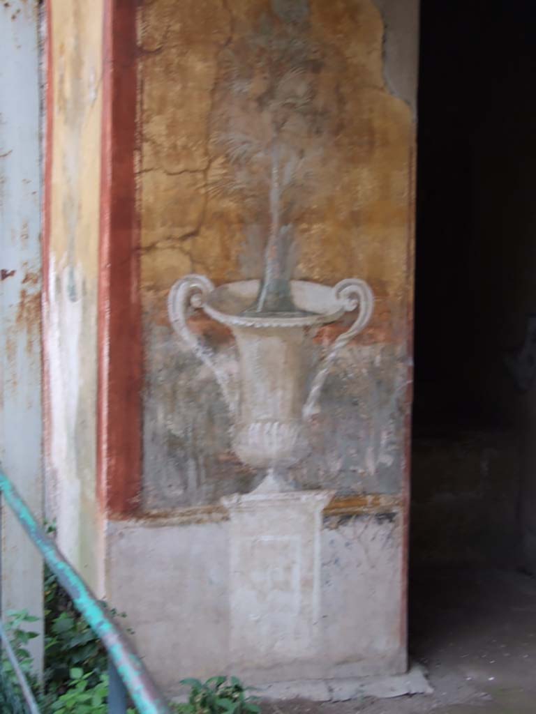 II.3.3 Pompeii. December 2006.
Room 17, exterior west side of sacellum. Wall painting of crater, fountain and tree.