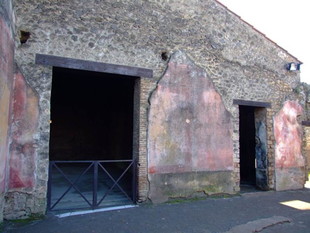 II.3.3 Pompeii. March 2009. Room 2, west wall of atrium, with doorways to rooms 5 and 6.