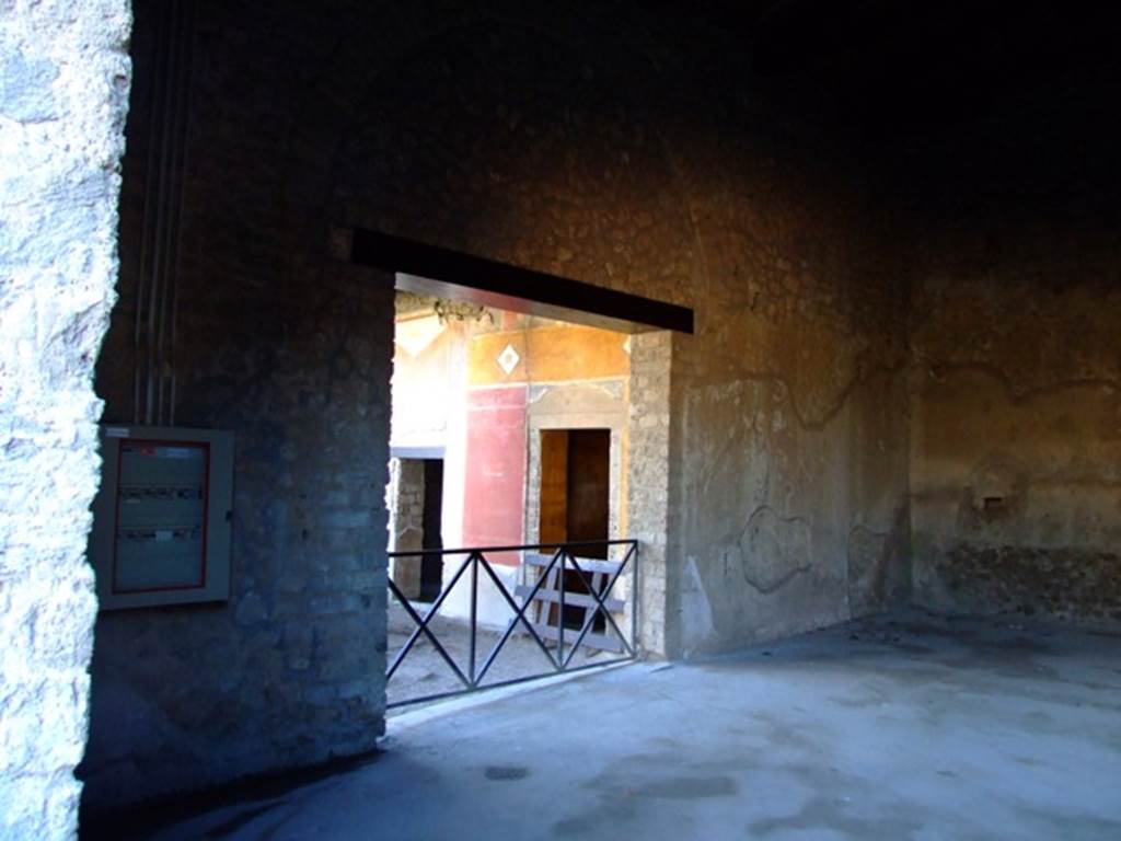 II.3.3 Pompeii. March 2009. Room 5, south wall with second doorway from north portico.
