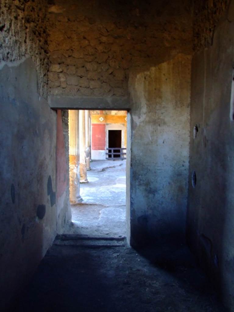 II.3.3 Pompeii. March 2009. Room 8, West wall, and doorway to Room 11, Portico.