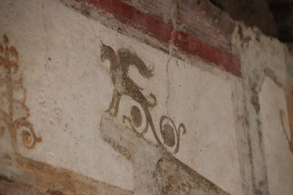 II.3.3 Pompeii. October 2023. Room 10, detail from south end of centre of upper east wall. Photo courtesy of Klaus Heese
