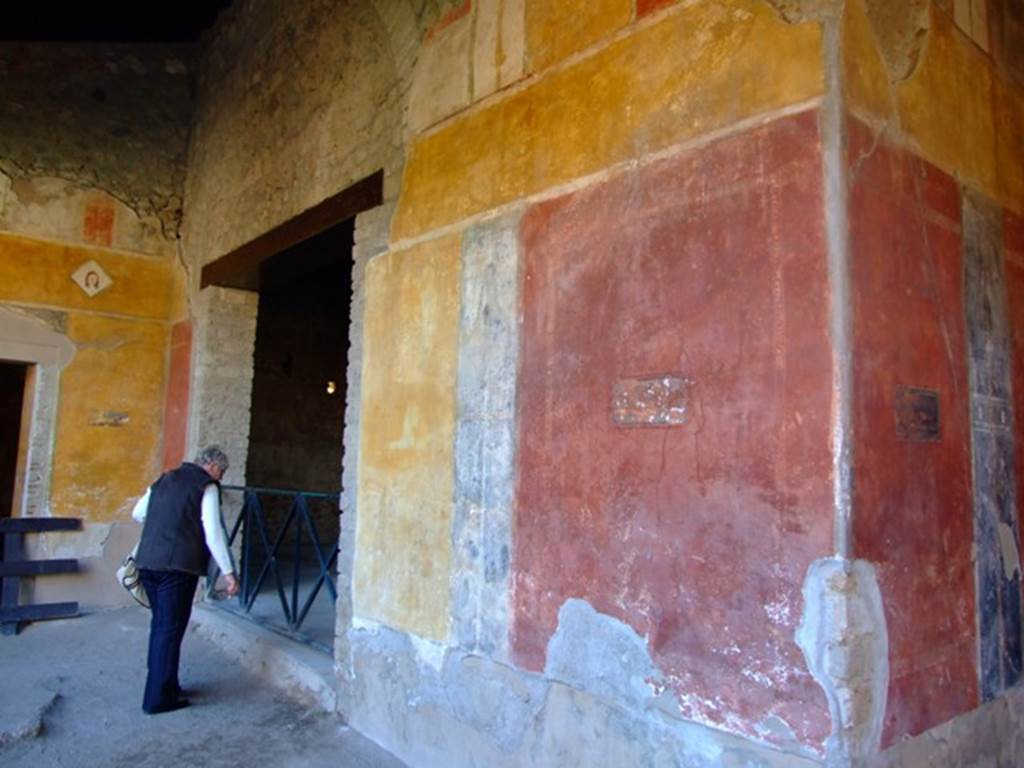 II.3.3 Pompeii. March 2009. Room 11, west end of north wall of north portico, and doorway to room 5.