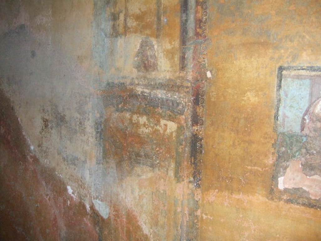 II.3.3 Pompeii. December 2006. Room 12, north wall at west end of cubiculum with architectural painting with mask.