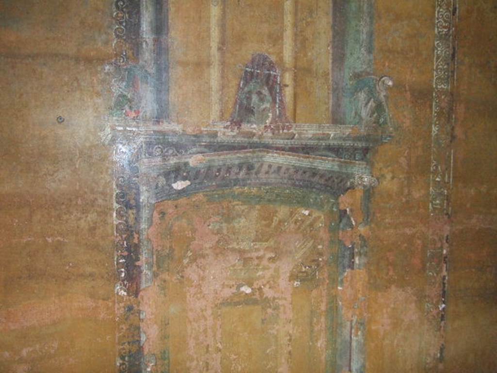 II.3.3 Pompeii. December 2005. Room 12, north wall at east end showing architectural painting with mask..