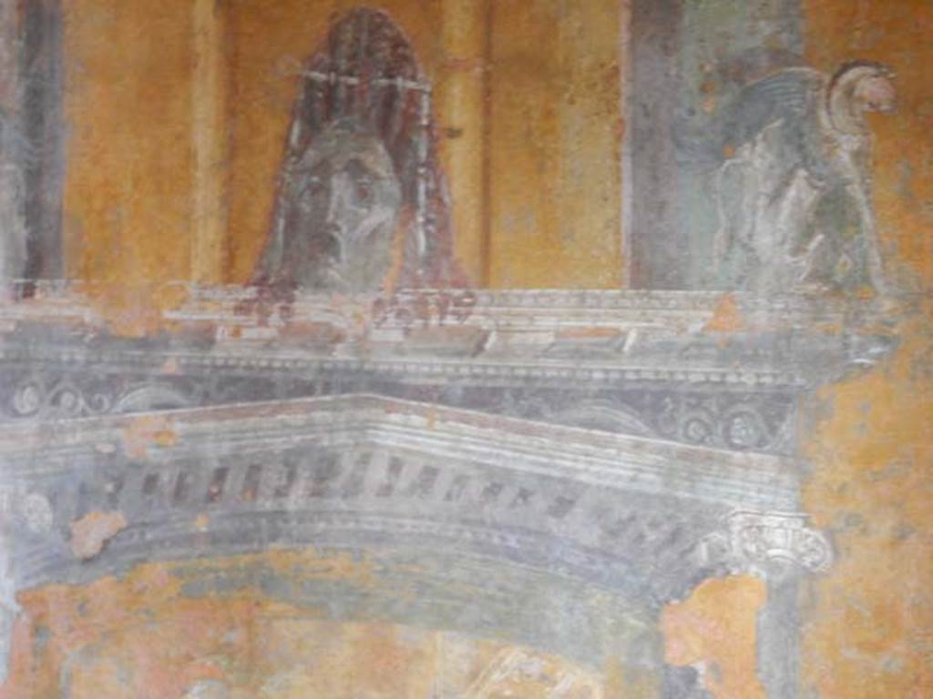 II.3.3 Pompeii. May 2016. Room 12, detail of painted mask from north wall at east end. Photo courtesy of Buzz Ferebee.