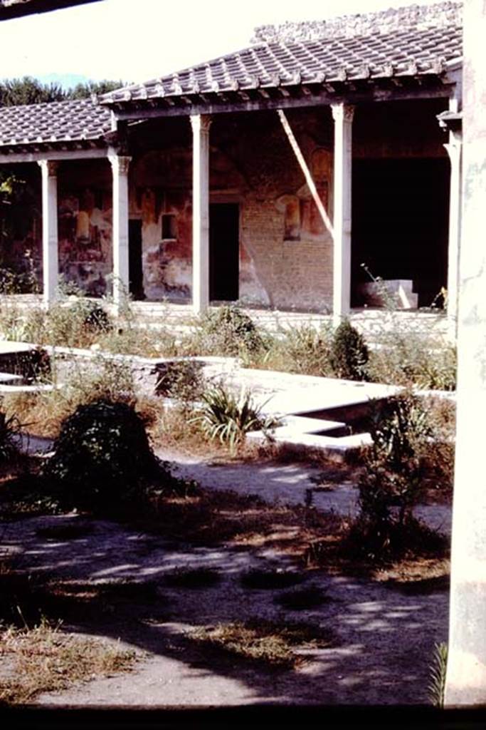 II.4.6 Pompeii. 1966. Looking south-west across garden and water feature towards portico, with doorway to summer triclinium, on right. Photo by Stanley A. Jashemski.
Source: The Wilhelmina and Stanley A. Jashemski archive in the University of Maryland Library, Special Collections (See collection page) and made available under the Creative Commons Attribution-Non Commercial License v.4. See Licence and use details. J66f0429