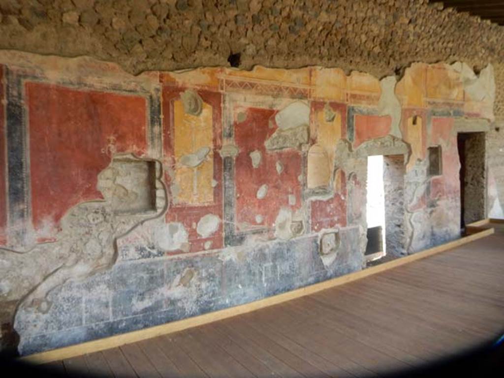 II.4.6 Pompeii. May 2016. Looking towards painted west wall of portico, at its southern end. The doorway of the room, pictured below, is on the right. Photo courtesy of Buzz Ferebee.