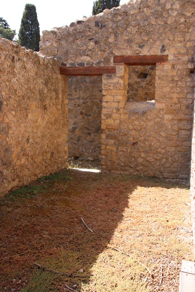 II.4.6 Pompeii. September 2019.
Looking west into room on south side of previous room, with doorway to rear corridor in its west wall.
Photo courtesy of Klaus Heese.