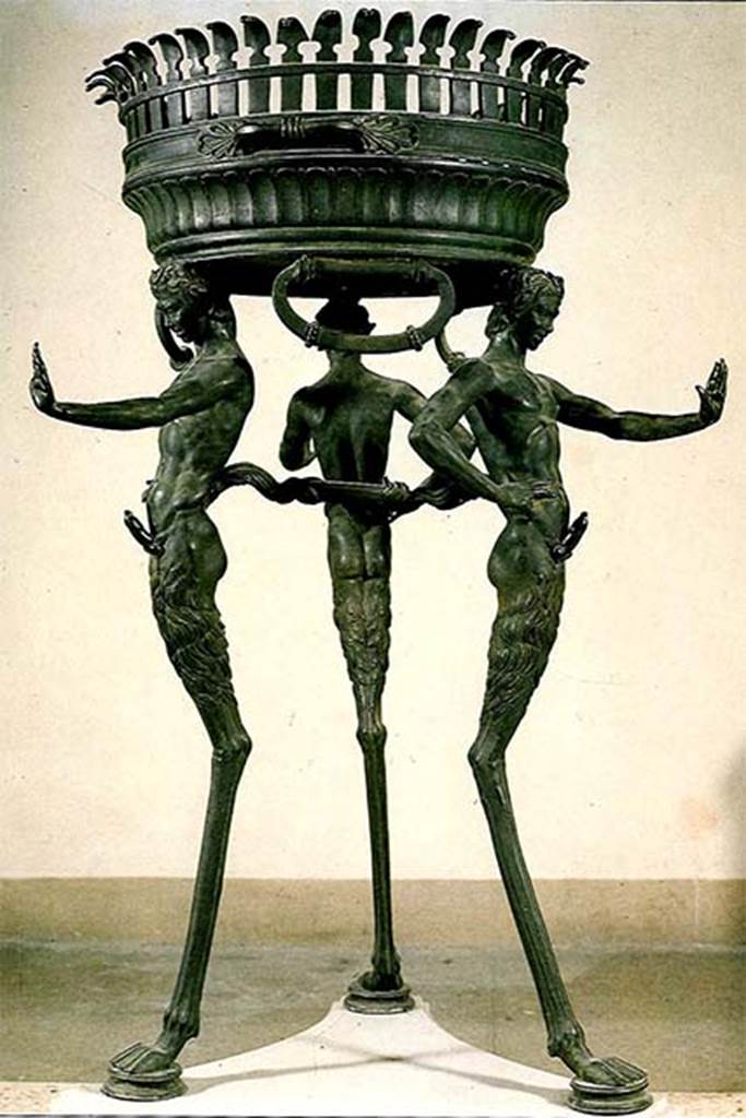 II.4.6 Pompeii. Found in the sacrarium 15th June 1755.
Bronze brazier tripod supported by three ithyphallic satyrs as legs.
Now in Naples Archaeological Museum. Inventory number 27874.