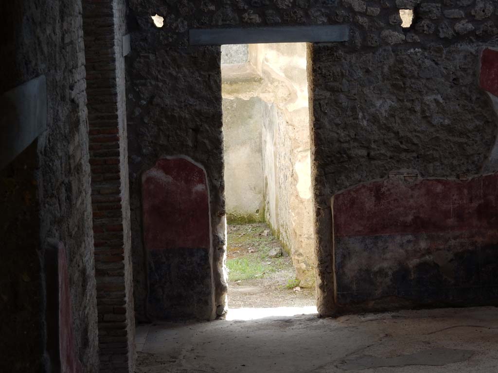 II.4.10 Pompeii. June 2019. Looking south across atrium towards doorway to room on south side.
Photo courtesy of Buzz Ferebee.