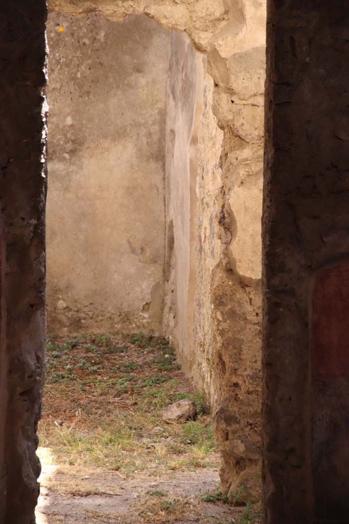 II.4.10 Pompeii. September 2019. Looking south through doorway into room on south side of atrium.
Photo courtesy of Klaus Heese.