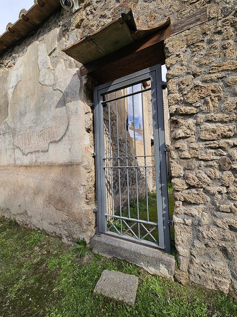 II.4.10 Pompeii. November 2024.
Entrance doorway on south side of painted inscriptions. Photo courtesy of Annette Haug.