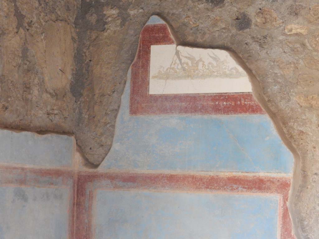 II.4.10 Pompeii. June 2019. Biclinium, detail of panel on east end of south wall. Photo courtesy of Buzz Ferebee.