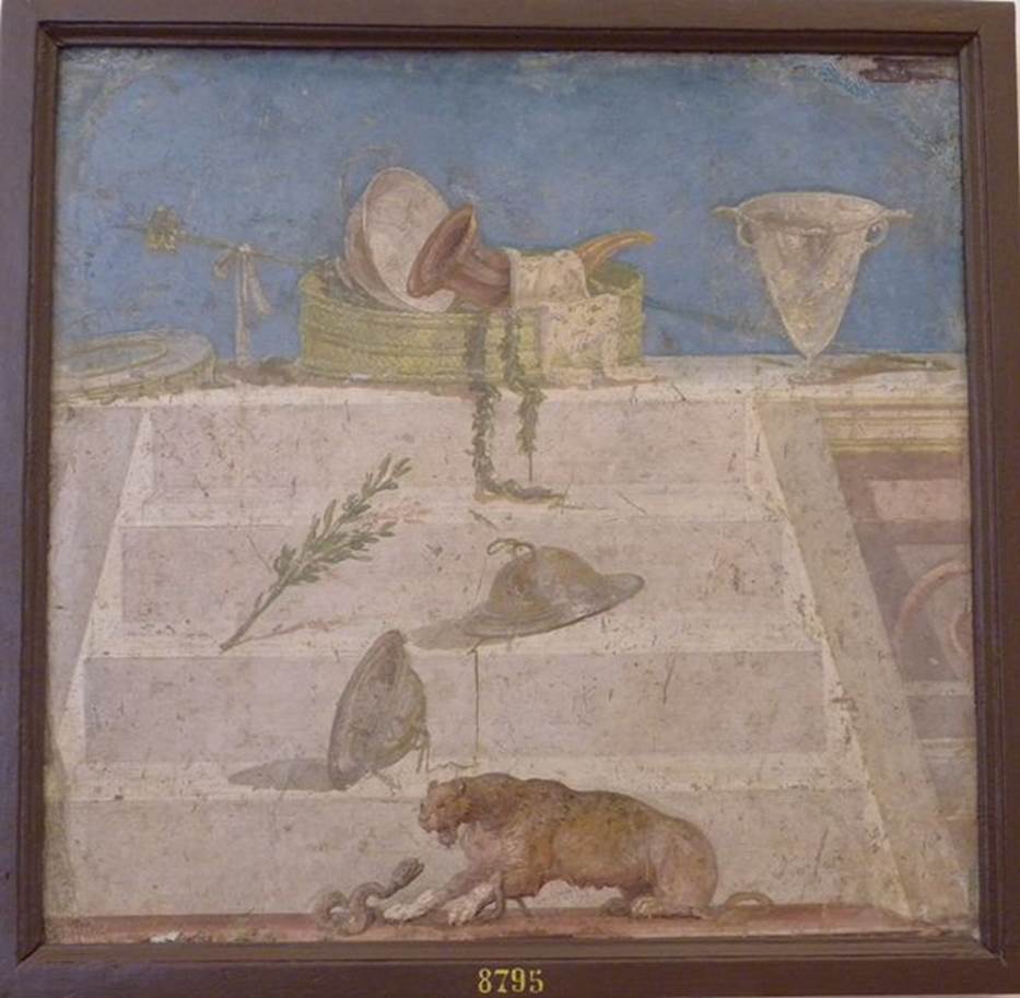 II.4.10 Pompeii. Found 22nd June 1755. Wall painting with symbols of Dionysus. Now in Naples Archaeological Museum. Inventory number 8795.
According to Parslow, this painting most probably came from the biclinium as the blue background matches the remaining walls of the room. See Rivista di Studi Pompeiani, Vol II, 1988: Parslow, C: Documents illustrating the excavations of the Praedia of Julia Felix (p.43)