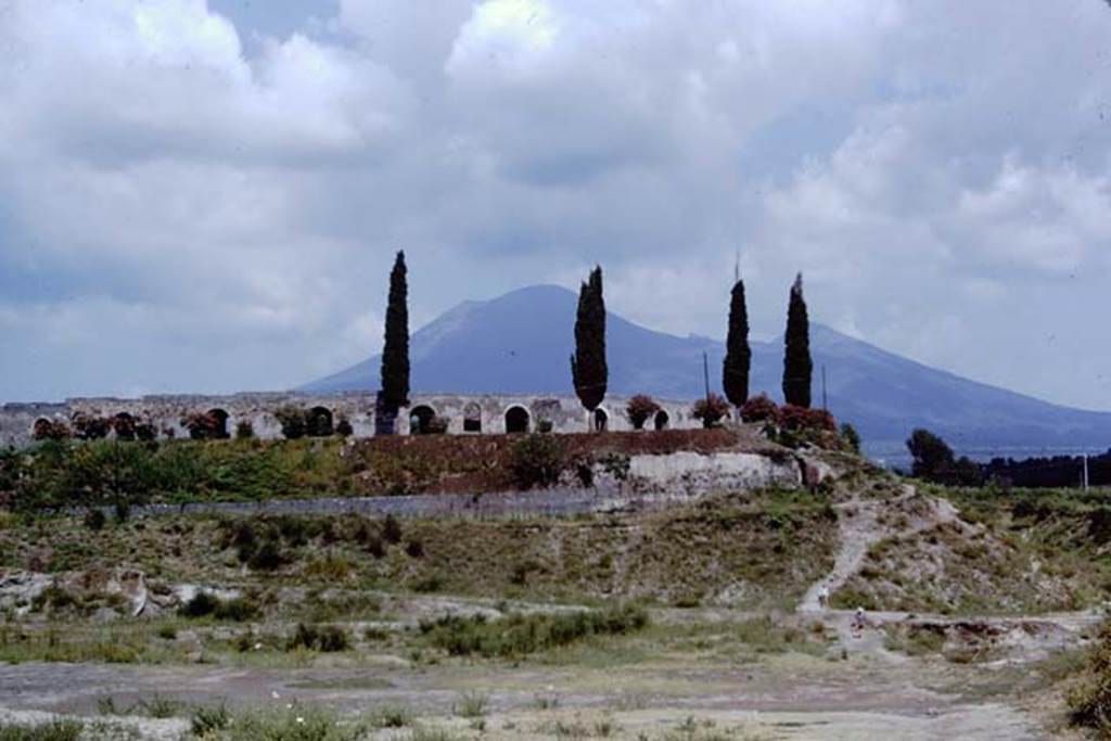 II.6 Pompeii. 1968. Looking north to ampitheatre and section of wall near Tower V, on right.
Photo by Stanley A. Jashemski.
Source: The Wilhelmina and Stanley A. Jashemski archive in the University of Maryland Library, Special Collections (See collection page) and made available under the Creative Commons Attribution-Non Commercial License v.4. See Licence and use details.
J68f1755