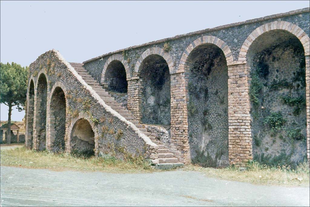 II.6 Pompeii. June 1962. Amphitheatre, looking towards south side of north-west double staircase.
Photo by Brian Philp: Pictorial Colour Slides, forwarded by Peter Woods
(P43.8 POMPEII external stairs to upper tiers Amphitheatre)