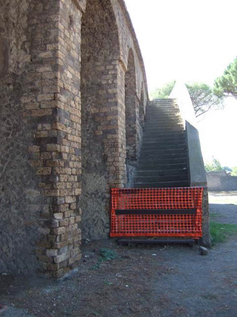 II.6 Pompeii. September 2005.
Amphitheatre, looking west along north side of north-west double staircase.