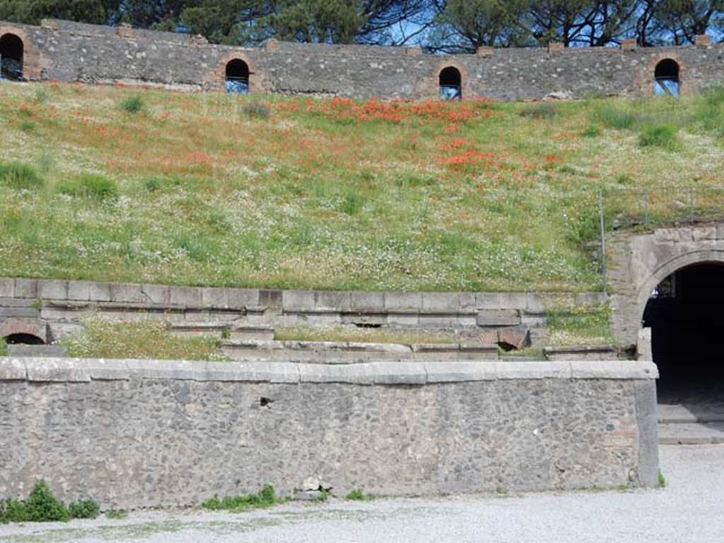 II.6 Pompeii, May 2018. Detail of seating on west side of north entrance to amphitheatre.
Photo courtesy of Buzz Ferebee.