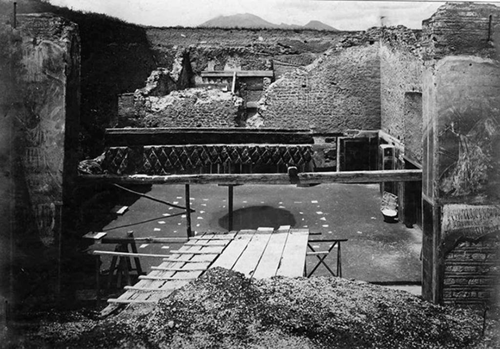III.3.6 Pompeii. Old postcard, c. 1916? During excavation?
Looking into Schola Armaturarum with cast of shutters in centre.